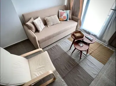 a living room with a couch and a table at Luxury One bedroom in gouna in Hurghada