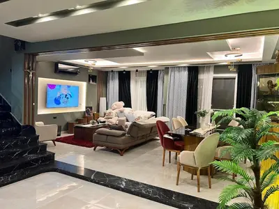 a living room with a teddy bear on a couch at Sky star 130 in Hurghada