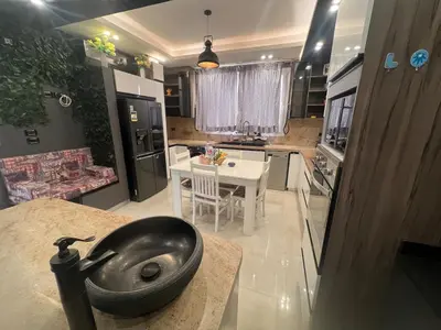 a kitchen with a black bowl sink on a counter at Sky star 130 in Hurghada