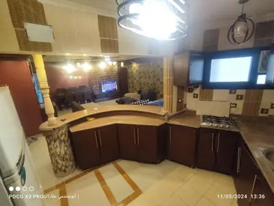 a kitchen with a sink and a stove in it at SuperElite apartment NileView F4 in Naj‘ al ‘Amrāb