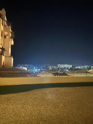 a view of a city at night from a building at Aldau heights 2 in Hurghada