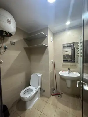a bathroom with a toilet and a sink at Aldau heights 2 in Hurghada