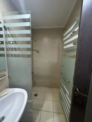 a bathroom with a sink and a shower at Aldau heights 2 in Hurghada