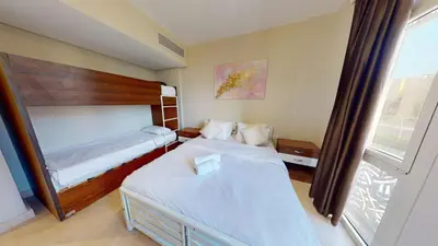 a hotel room with two beds and a window at 2bedroom in mangrove in gouna in Hurghada