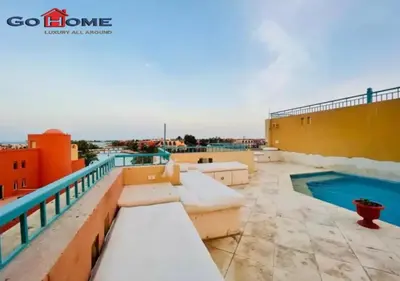 a balcony with a swimming pool on top of a building at Pretty 4Bedrooms Penthouse MB7 at New Abu Tig Marina in Hurghada