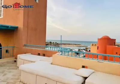 a view of the beach from the balcony of a building at Pretty 4Bedrooms Penthouse MB7 at New Abu Tig Marina in Hurghada
