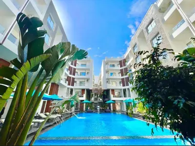 a large swimming pool in the middle of a building at Studio Imperial resort pool view in Hurghada