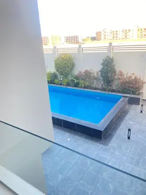 a swimming pool in the middle of a building at Studio Imperial resort pool view in Hurghada
