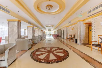 a large lobby with chairs and a rug on the floor at Sunrise Solara Aqua park Resort in Banī Ghālib
