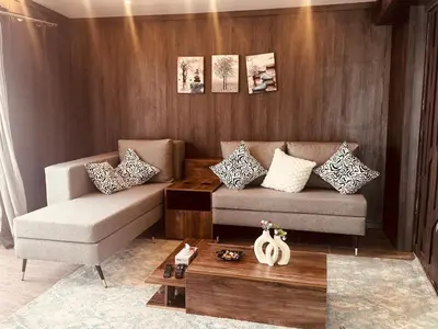 a living room with a couch and a coffee table at Prestige Home apartment in Hurghada