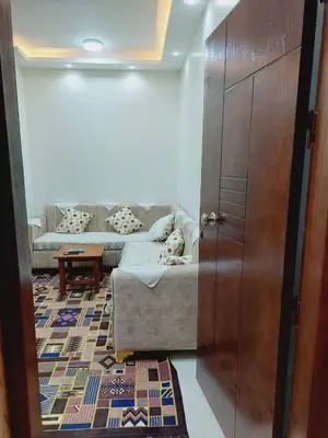 a living room with a couch and a table at Wohnung in Al Ahyaa Hurghada in Hurghada