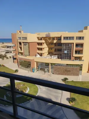 a view of a building from a balcony at Tiba golden resort in Hurghada