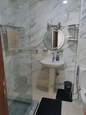 a bathroom with a sink and a mirror at Tiba golden resort in Hurghada