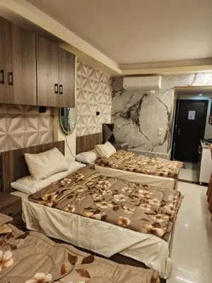 a room with two beds in a room with at Cecilia Village in Hurghada