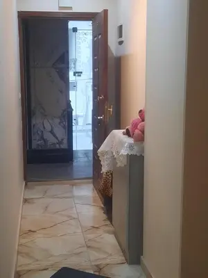 a hallway with a door to a room with a tile floor at Sea view holidays in Hurghada