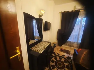 a room with a chair and a window at Sea view holidays in Hurghada
