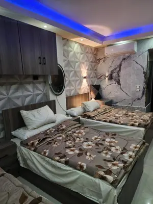 a bedroom with a large bed with shells on it at Cecilia Village in Hurghada
