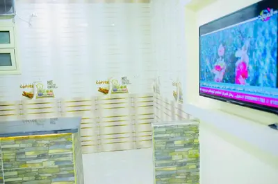 a flat screen tv on a wall in a room at رويال بالاس in Hurghada