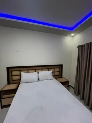 a bedroom with a bed with a blue ceiling at رويال بالاس in Hurghada