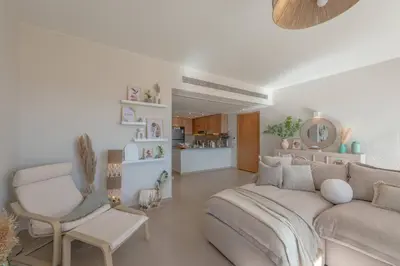 a living room with a couch and a chair at Stylish 3 BR Retreat at Ancient Hills El Gouna in El Gouna