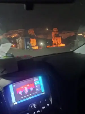 a view of the dashboard of a car at night at White Rose House in Luxor