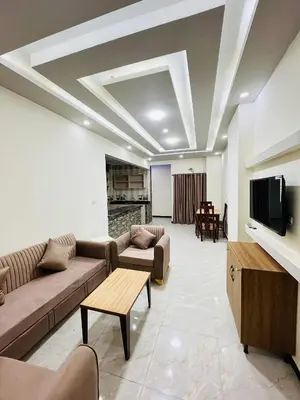a large living room with couches and a tv at Royal palace in Hurghada