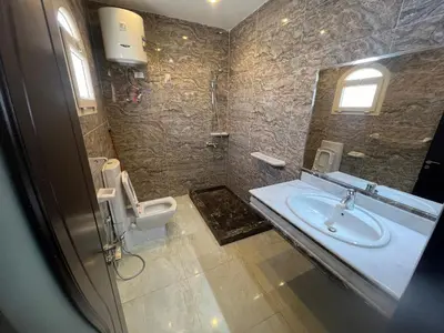 a bathroom with a sink and a toilet at Apartment with sea view in Hurghada