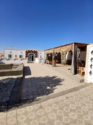 a view of a courtyard with a building at Mashamman nuban house in Aswan