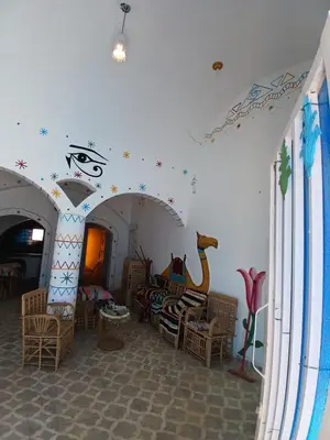 a room with a room with a playroom with a room with a giraffe at Mashamman nuban house in Aswan