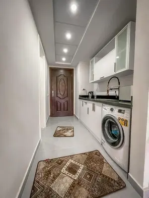 a kitchen with a washer and dryer in a room at Scandic Resort Hurghada in Hurghada
