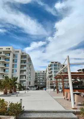 a view of two large apartment buildings with a playground at Scandic Resort Hurghada in Hurghada