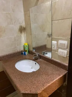 a bathroom counter with a sink and a mirror at سيسليا بيتش ريزورت in Hurghada