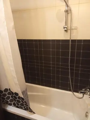 a bathroom with a shower and a bath tub at , كمبواند قمريه in Hurghada