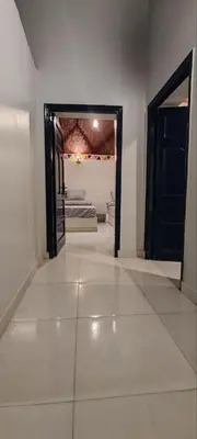 a hallway with an open door to a room at Kemet Guest House in Aswan