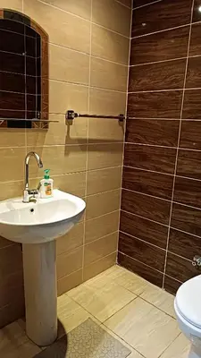 a bathroom with a sink and a toilet at Cozy studio Florenza Khamsin in Hurghada
