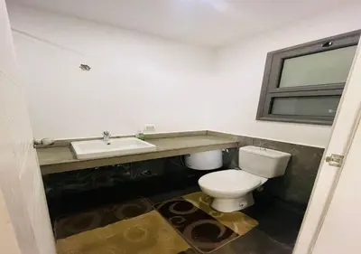 a bathroom with a toilet and a sink at Comfort 3BR Apartment C1-D with Private Heated Pool at Bali Elgouna in Hurghada