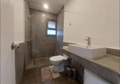 a bathroom with a sink and a toilet at Comfort 3BR Apartment C1-D with Private Heated Pool at Bali Elgouna in Hurghada