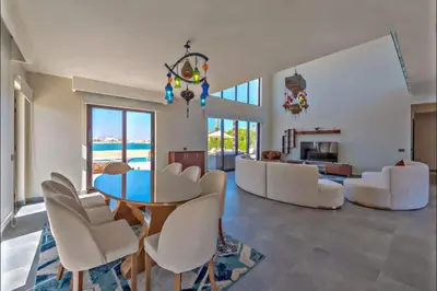 a living room with a table and white chairs at Villa luxury 5bedroom in gouna in Hurghada
