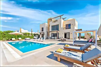a villa with a swimming pool and a house at Villa luxury 5bedroom in gouna in Hurghada