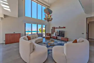 a living room with white furniture and a chandelier at Villa luxury 5bedroom in gouna in Hurghada