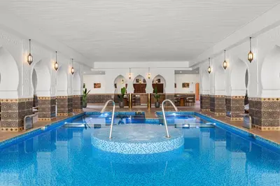 a pool in a hotel lobby with a swimming pool at Albatros Makadi Resort - 24 HRS All Inclusive in Hurghada