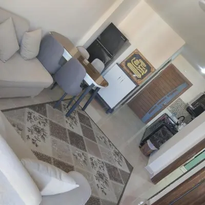a living room with a couch and a table at Golden Tayeb Hurghada Compound in Hurghada