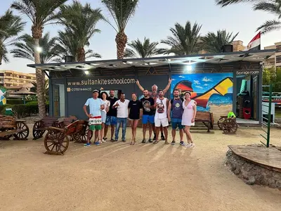a group of people standing in front of a building at Cozy Apartment with Red Sea View in Hurghada