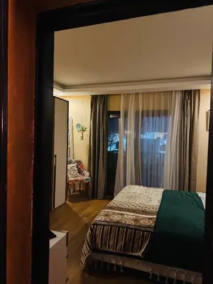 a hotel room with a bed and a window at شاليه في ستيلا مكادي الغردقة in Hurghada