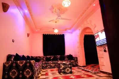 a living room with a couch and a ceiling at Habiba Apartment in Luxor