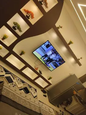 a living room with a ceiling with a tv on it at Tiba Golden a in Hurghada
