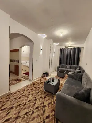 a large living room with a couch and a table at Nopian 1 in Luxor