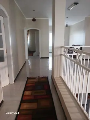 a hallway with a tile floor in a house at Valencia Villa & Rooms in Luxor