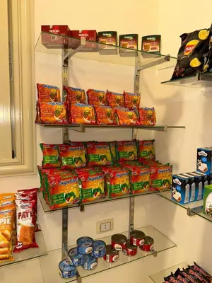a store with shelves of chips and other snacks at Holiday Dream Of Luxor in Luxor