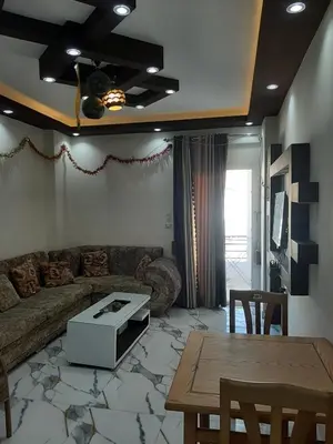 a living room with a couch and a table at شقه سوبر لوكس in Hurghada